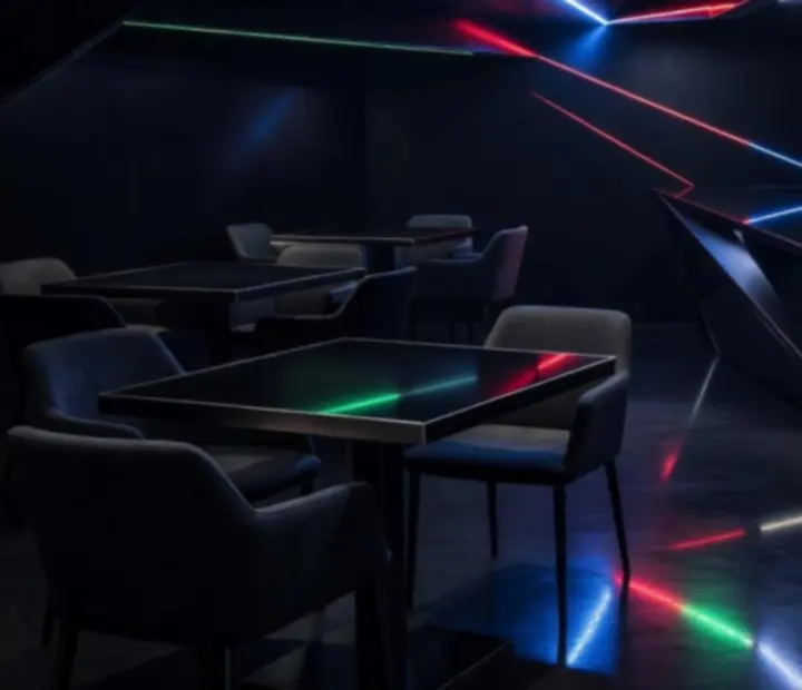 Interior details of NAXSOL ENTERPRISES LTD showing dark tones, angled lines, and vibrant lighting